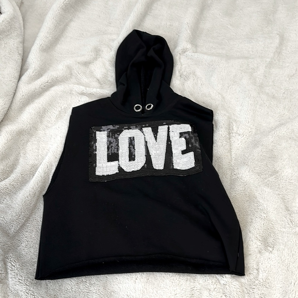 Black hoodie with sparkles spelling out love no sleeves and very comfortable